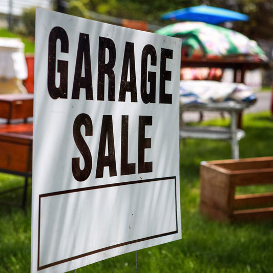 Garage sale sign in yard